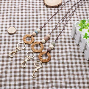 Handmade boho silicone and wood bead lanyard with woven geometric pendant and gold clip