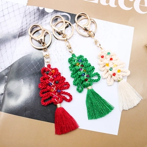 Handmade woven Christmas tree keychains in red, green and cream with tassels and beads