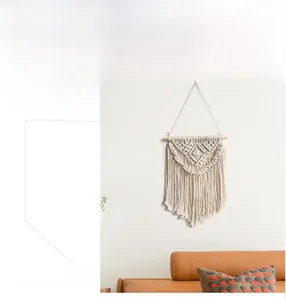 Detailed view of handmade bohemian wall hanging featuring intricate cotton rope weaving
