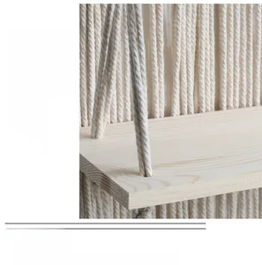 Detail showing high-quality solid wood texture and woven cotton ropes of the shelf