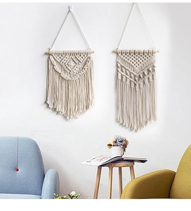 Detail of bohemian hand-woven wall hanging macrame set with elegant cotton tassels
