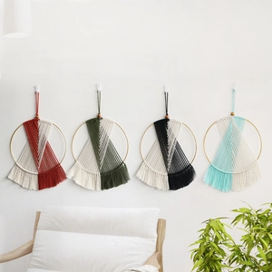 Set of four handmade Bohemian cotton woven wall hangings with golden rings and fringe