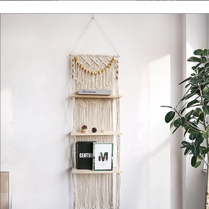 Detailed macro view of bohemian hand-woven cotton rope texture and natural wood shelf board