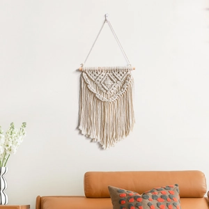 Handwoven Bohemian macrame wall hanging with cotton tassels and wooden rod for home decor