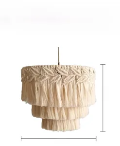 Detail of 3-tier macrame woven lampshade in ivory cotton with fringe and leaf patterns