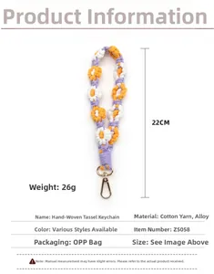 Detail view of a 22cm handmade woven floral keychain lanyard with dimensions and specs