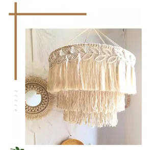 Detail of bohemian hand-woven cotton lamp shade with three-tier tassel and diamond textures