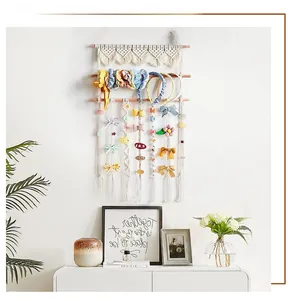 Detail of bohemian woven cotton wall organizer for hair bows and accessories