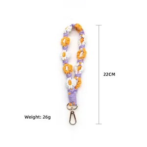 Handmade woven flower wrist strap in purple and orange with 22cm length gold clasp