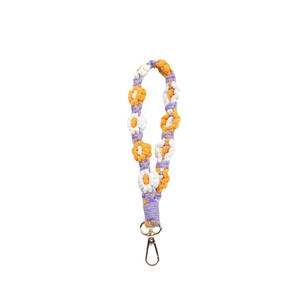 Handmade woven flower keychain lanyard with orange and purple petals and golden clasp
