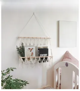 Detail of bohemian hand-woven cotton wall tapestry showing mesh magazine storage pocket