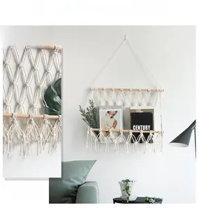 Close-up of Macrame woven wall magazine rack with cotton ropes and wooden rods
