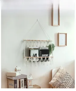 Detailed close-up of handmade bohemian woven cotton rope wall magazine storage hanger