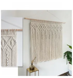 Detail showing hand-woven macrame wall hanging with intricate bohemian knots and cotton tassels