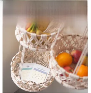 Detail of macrame hanging basket with woven cotton rope layers for fruit storage