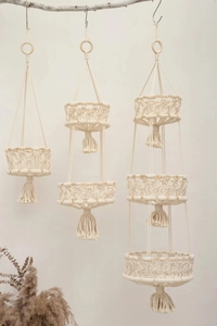 Detailed macro view of bohemian hand-woven macrame cotton rope layers with elegant fringe