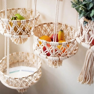 Handwoven macramé fruit basket with cotton rope and bamboo rings in boho style