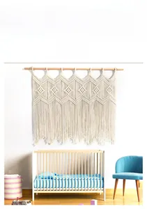 Detailed close-up of handmade Macrame tapestry with geometric patterns and cotton tassels