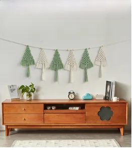 Close-up of Nordic woven Christmas tree wall hanging with cotton rope tassels and wooden beads