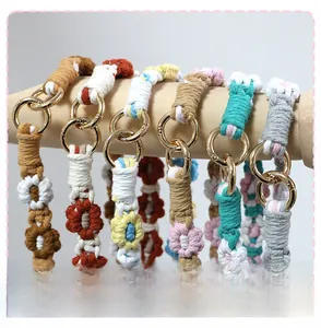 Detail of colorful woven daisy flower charms with durable golden alloy ring clasps