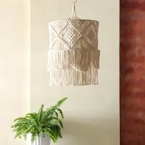 Detailed macro view of Bohemian handmade macrame lamp shade with fringe and geometric knots