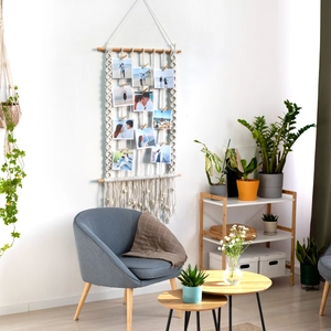 Bohemian handwoven macrame wall hanging photo display with wooden beads and clips