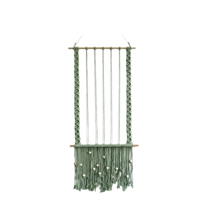 Sage green boho wall hanging photo display with handmade macrame fringe and wooden beads