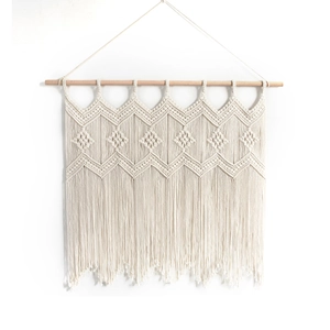 Handwoven Bohemian cotton tapestry wall hanging with fringe and a natural wooden rod