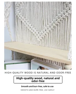 Detail of hand-woven cotton ropes and smooth natural wood board for wall shelf decoration