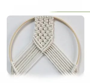 Close-up of bohemian peace sign wall hanging with intricate cotton rope weaving detail