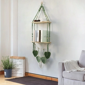 Green bohemian hand-woven tapestry shelf with wood boards and leaf tassels for wall decor