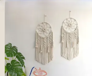 Detail of bohemian dream catcher wall hanging with handmade macrame cotton rope tassels