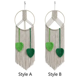 Handmade boho cotton rope wall hanging with peace sign and green leaf details