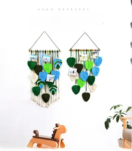 Detail of leaf-shaped woven tapestry fringe and mini wooden clips for photos
