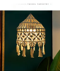 Close-up of bohemian hand-woven cotton lamp shade with geometric patterns and tassels