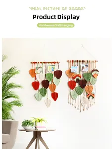 Detail of handmade woven leaf tapestry with bohemian tassels and wooden photo clips