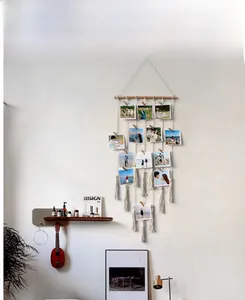Bohemian woven macrame wall hanging photo display with wooden clips and tassels