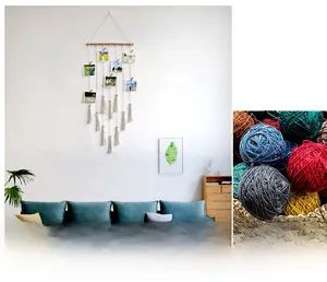 Detail of Nordic Bohemian macrame photo wall hanging with wooden clips and colorful pom poms