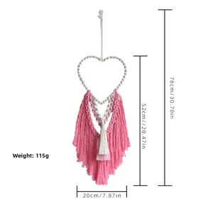 Detail view of handmade macrame heart wall hanging with dimensions and product specifications