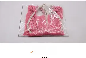 Pink and white bohemian woven heart tapestry bag dimensions shown as 26cm x 26cm x 3cm
