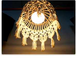 Detailed macro view of the Bohemian hand-woven macrame lampshade with layered cotton tassels