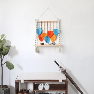 Nordic macrame wall hanging shelf with blue and orange hand-woven leaves for room decor