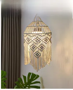 Detail of bohemian macramé lampshade with handmade cotton rope weave and fringe