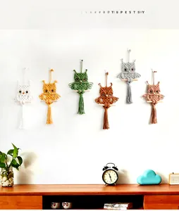 Detailed close-up of six colorful macrame owl tapestries in bohemian style wall decor