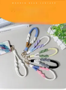 Close-up of handmade woven cotton lanyards in six colors with gold lobster clasps