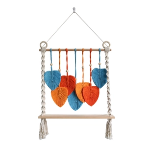 Boho macrame wall shelf with handmade colorful leaves and natural wood hanging decor