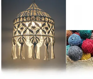 Detailed macro of bohemian handwoven cotton lampshade with diamond fringe and colorful yarn