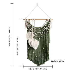 Detailed view of handmade bohemian wall hanging with woven leaves and wood beads, 45x94cm