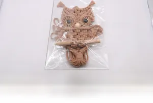 Detail showing handmade macrame owl wall hanging with dimensions 30cm height and 20cm width