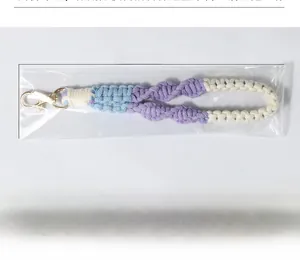 Detail view of a 22cm handmade woven braided lanyard with a gold-tone metal lobster clasp